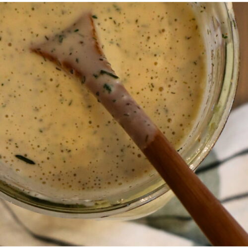 jar of dairy free ranch with a spoon