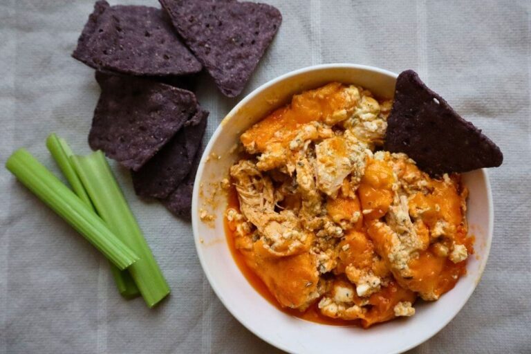 healthy buffalo chicken dip served with chips and veggies