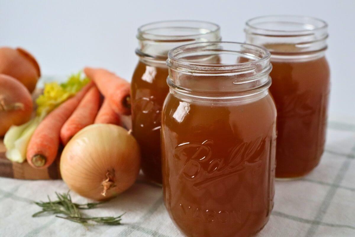 Large batch beef bone broth made in an electric roaster, rich and gelatinous