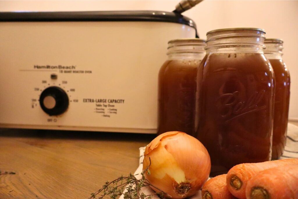 How to Make Beef Bone Broth in an Electric Roaster (Large Batch, From Scratch) 4 Beef bone broth canned in mason jars large bath method