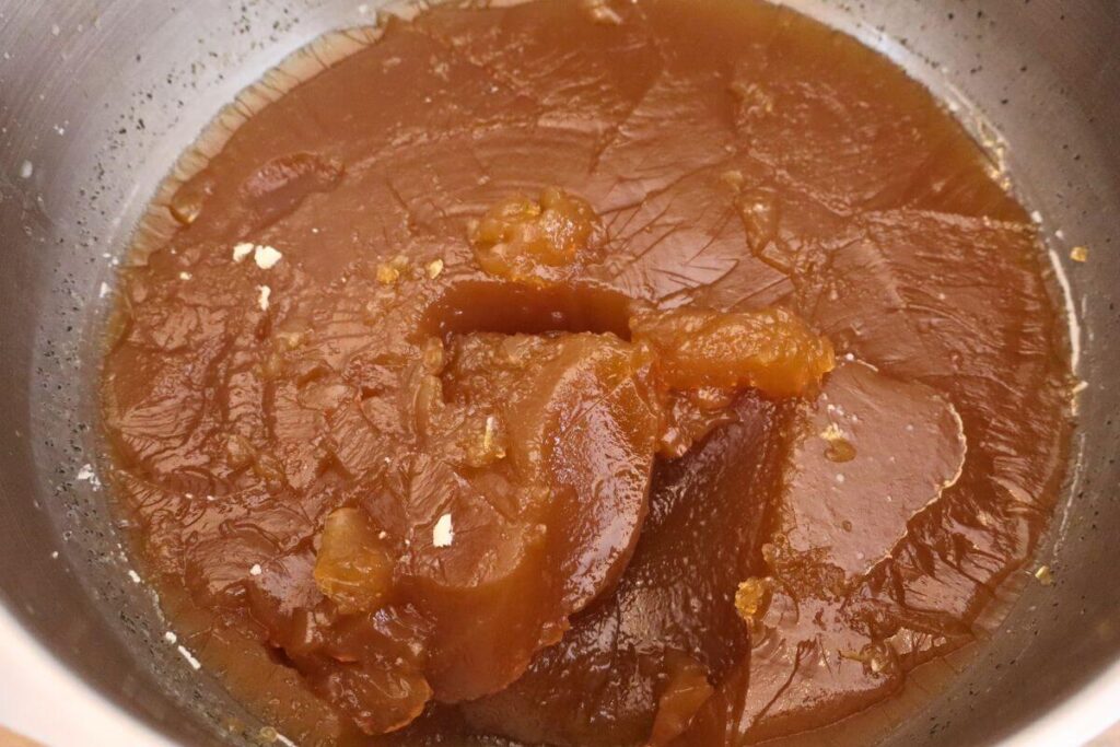 large bowl showing thick texture of gelatinous bone broth after refrigeration