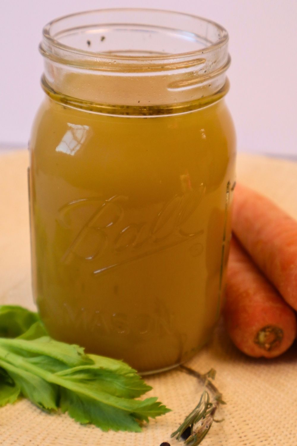 Easy one-day chicken bone broth recipe on the stovetop that still creates a rich, nourishing broth