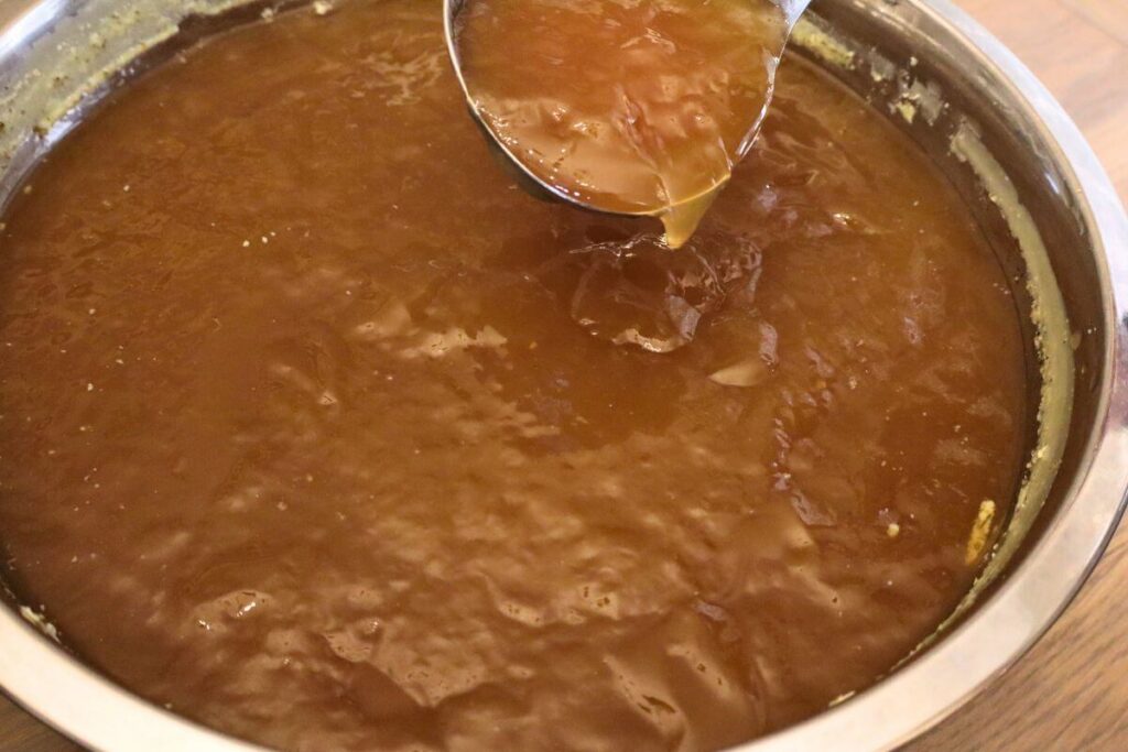 ladling gelatinous bone broth