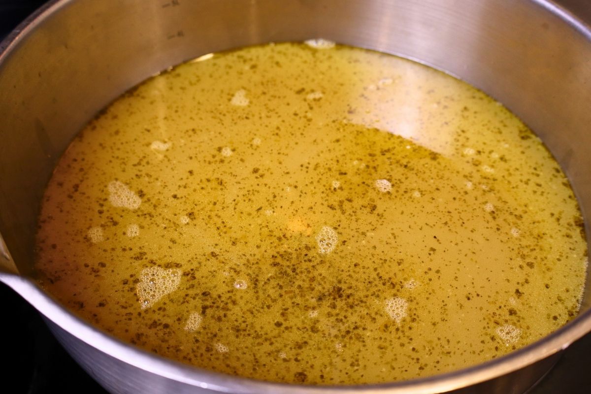 Bowl full of chicken bone broth after simmering.