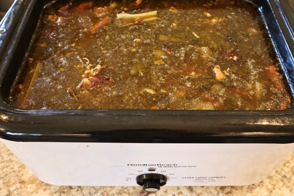 Chicken bone broth in an electric roaster