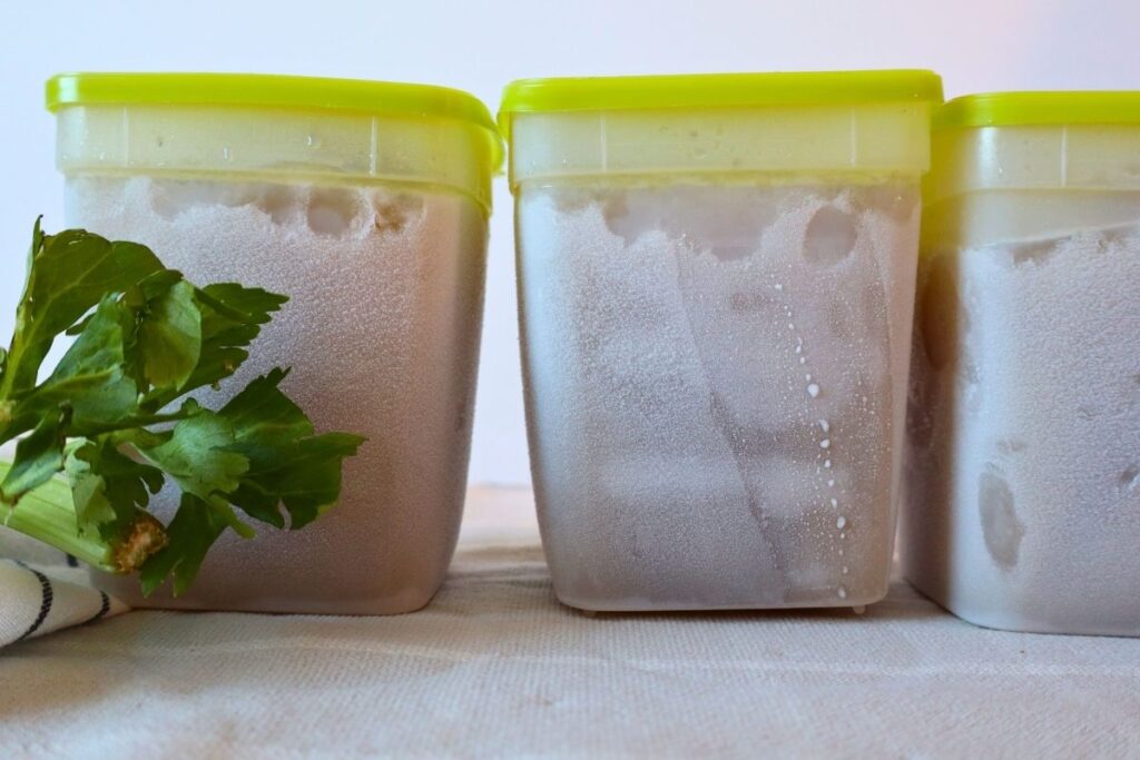 Easy way to store frozen bone broth in large plastic freezer containers.
