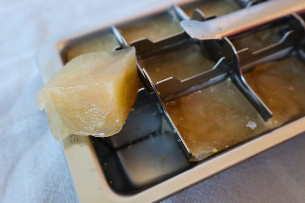 Example of freezing bone broth in small portions by using an ice cube tray.