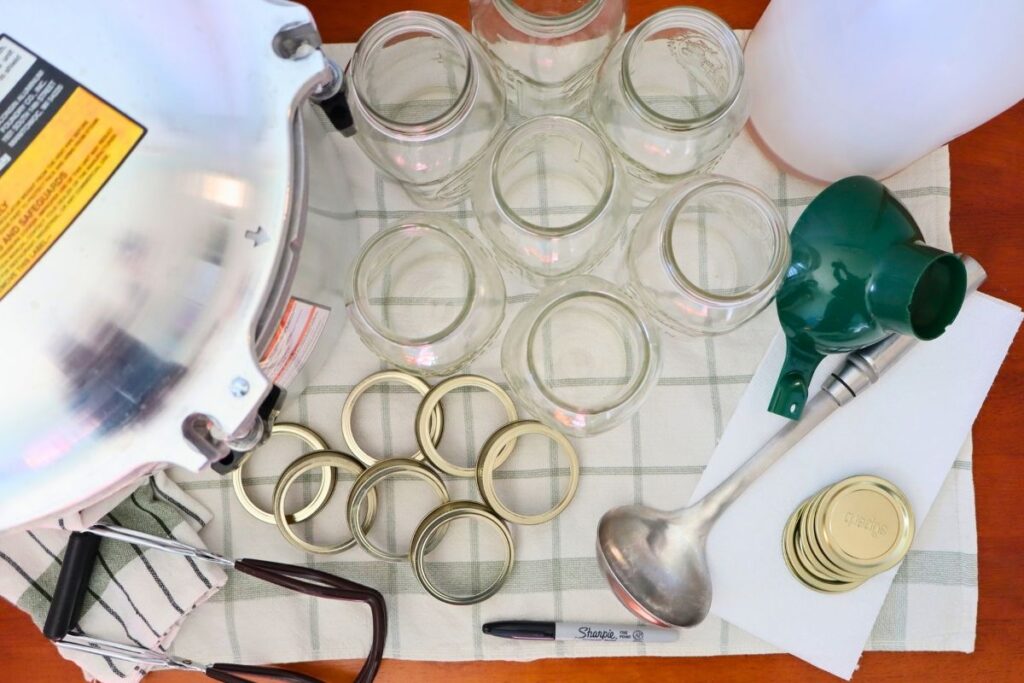 Pressure canner, mason jars, lids, rings, funnel, ladle, vinegar, jar lifter for pressure canning bone broth