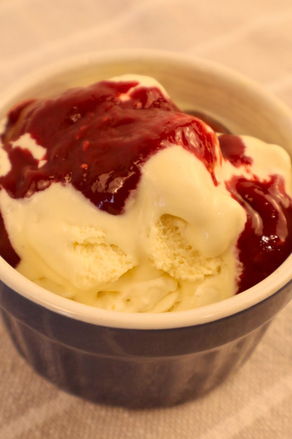 How to Make Raspberry Sauce with Frozen Raspberries 4 Easy raspberry sauce served over vanilla ice cream for a simple homemade dessert.