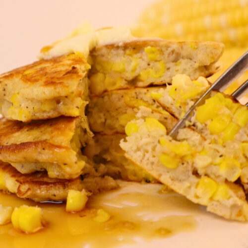 Gluten-Free Pennsylvania Dutch Corn Fritters 19 Maple syrup drizzled over a bite of gluten-free corn fritter on a fork