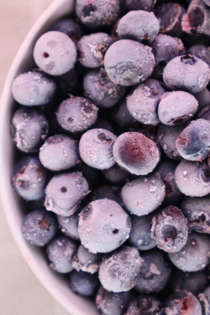 How to Freeze Fresh Blueberries for Year-Round Use 2 Frozen blueberries fill this bowl, showing just how easy homemade freezer blueberries can be