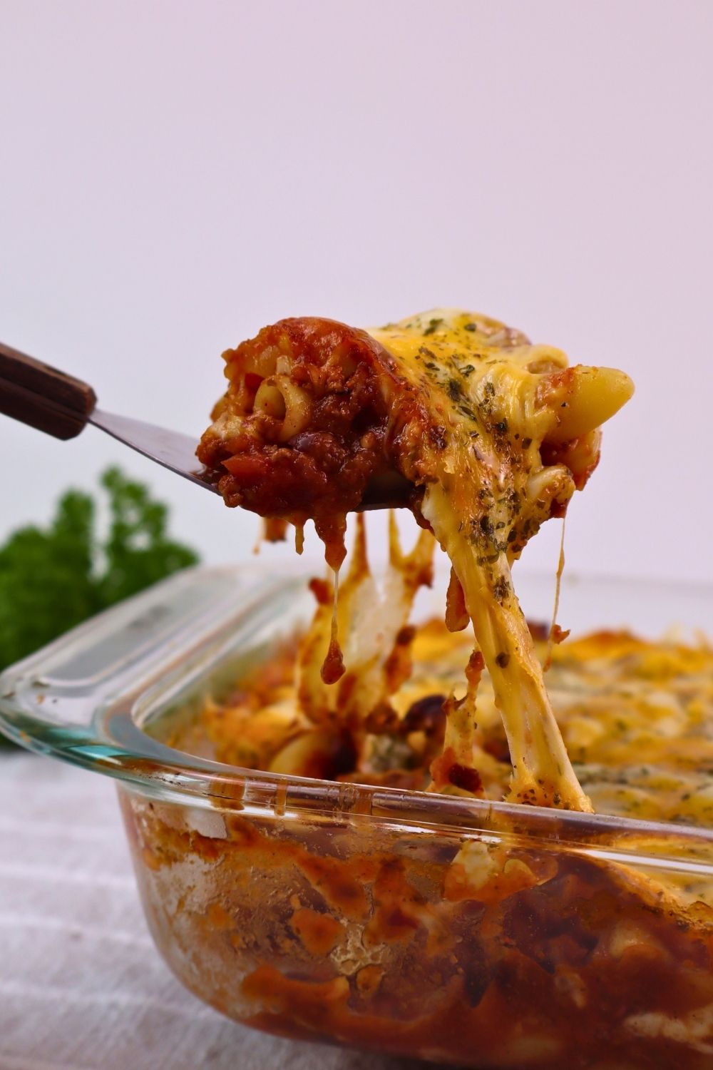 Easy Baked Gluten-Free Chili Mac 2 Pulling a cheesy bite of Gluten-Free Chili Mac right from the baking dish