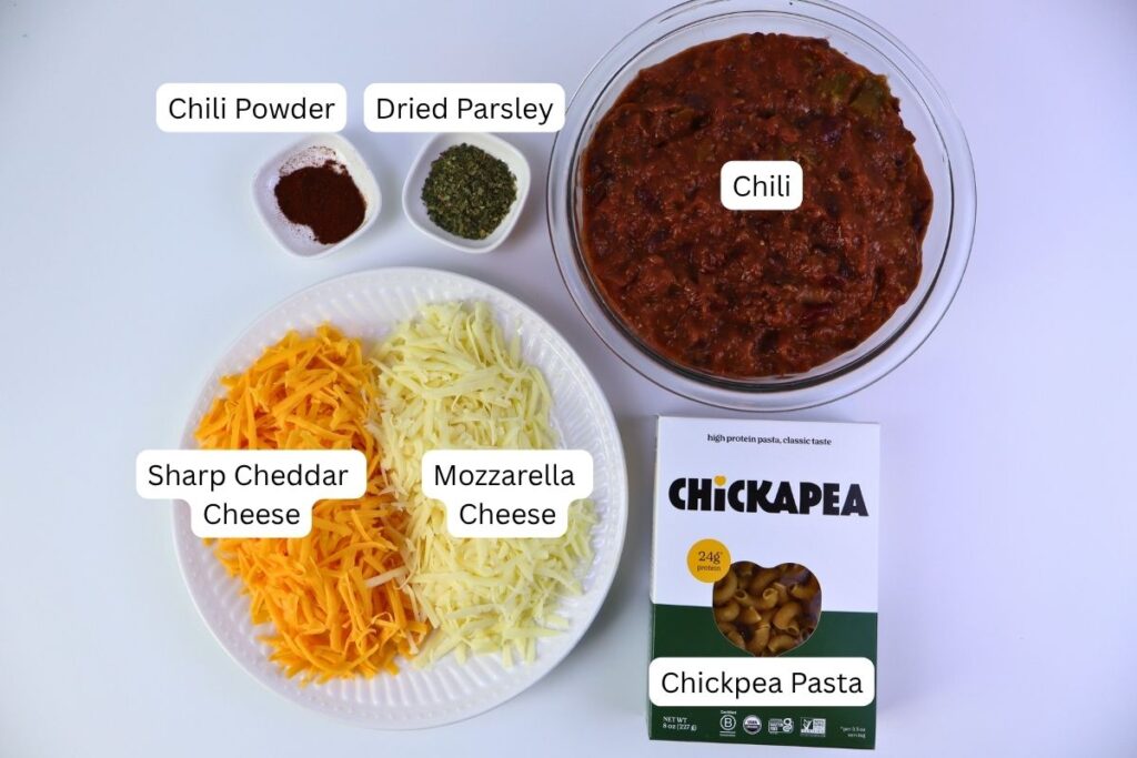 Easy Baked Gluten-Free Chili Mac 3 Ingredients for gluten-free chili mac including chickpea pasta, shredded cheese, and chili spices