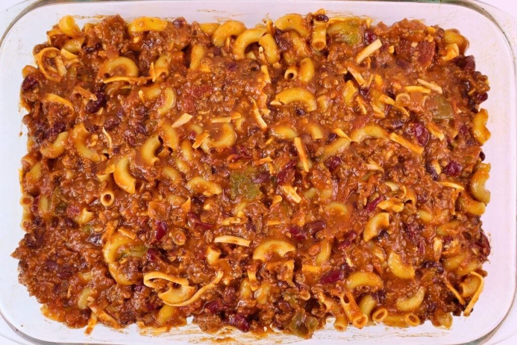 Easy Baked Gluten-Free Chili Mac 7 Gluten-free chili mac mixture spread into a baking dish before adding the cheese topping